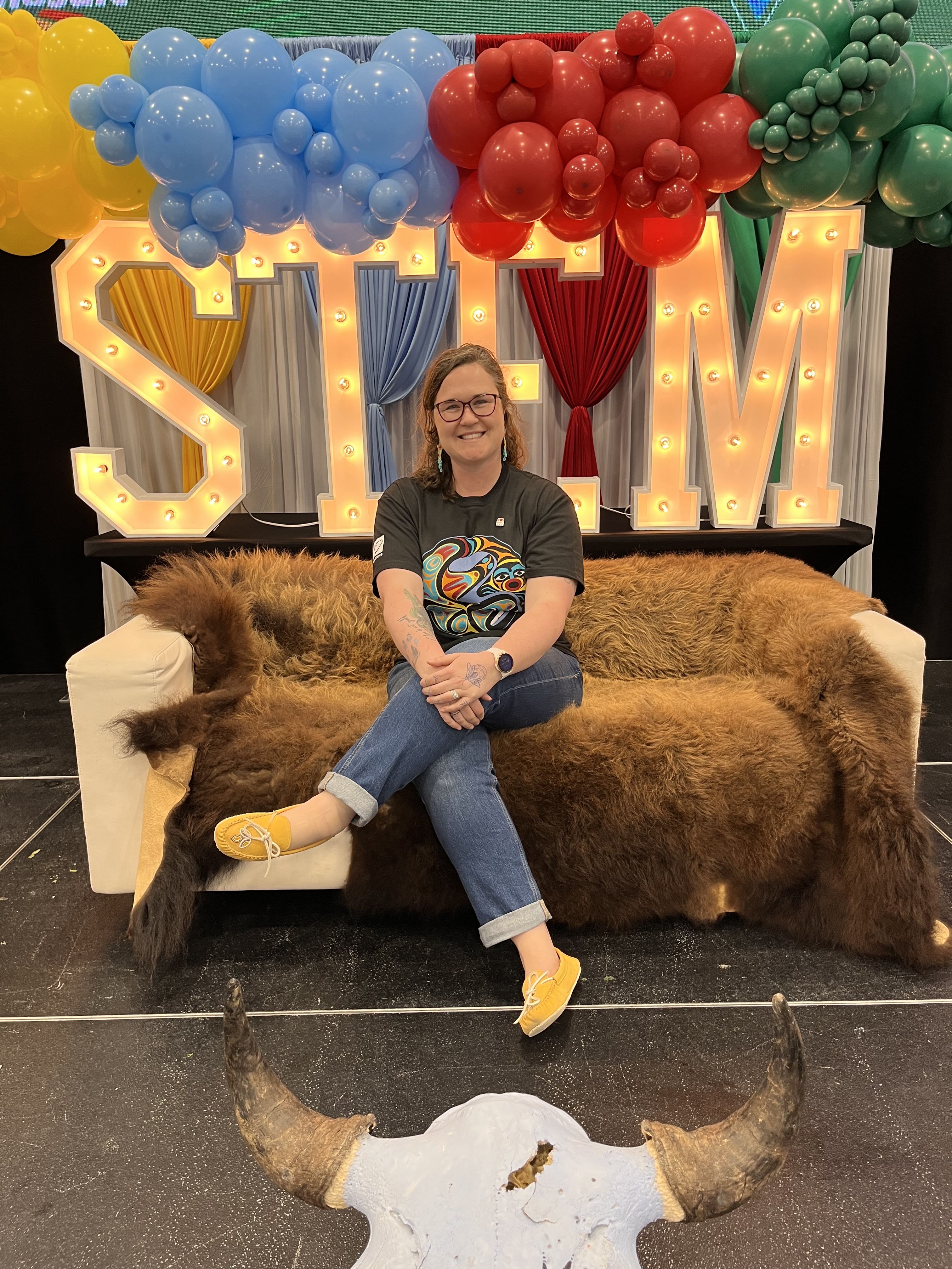 STEM lettering with Larkin sitting in front